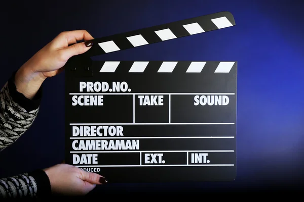 Movie clapper in female hand — Stock Photo, Image