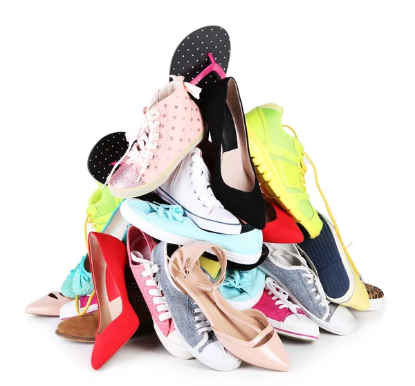 Stapel van verschillende vrouwelijke schoenen geïsoleerd op wit — Stockfoto