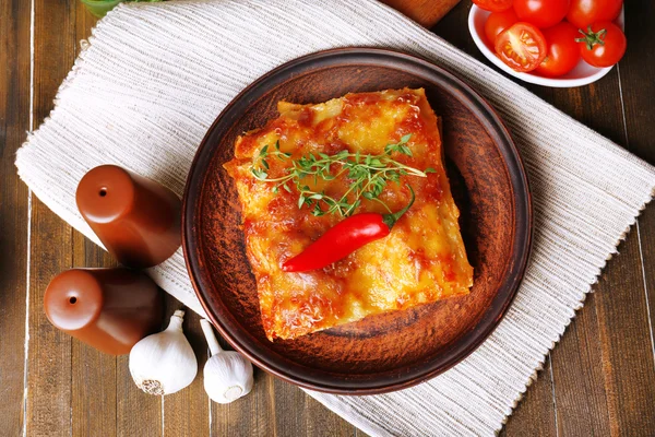 Portion of tasty lasagna on table — Stock Photo, Image