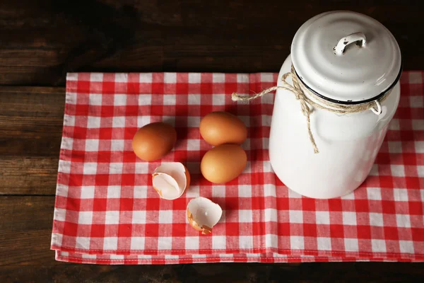 Milk can with eggs — Stock Photo, Image