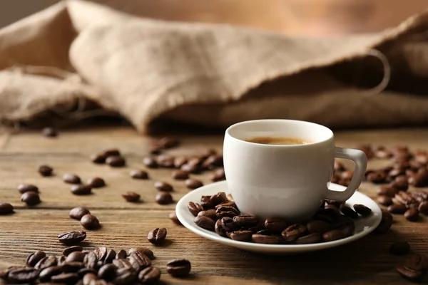 Cup of coffee on wooden table Stock Image