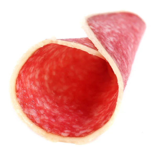 Rebanada de salami aislada sobre fondo blanco — Foto de Stock