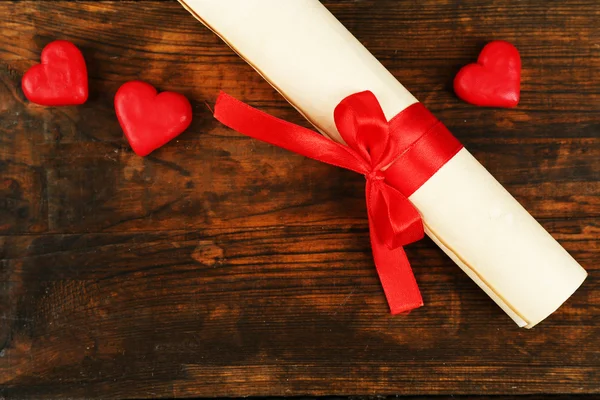 Rolled paper with hearts — Stock Photo, Image