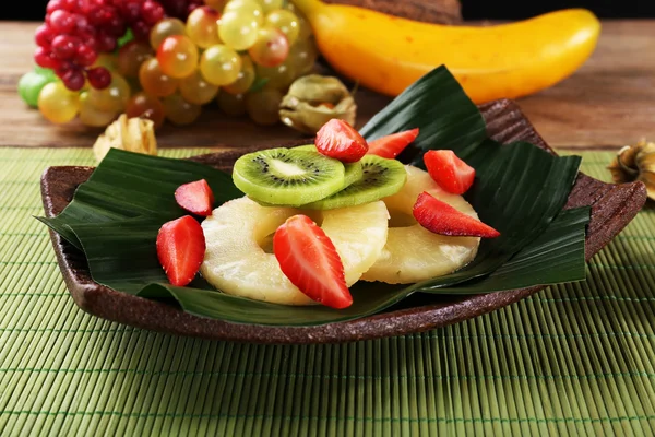 Fruit dessert on green leaf on table — Stock Photo, Image