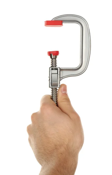Ferramenta de braçadeira na mão masculina isolada em branco — Fotografia de Stock