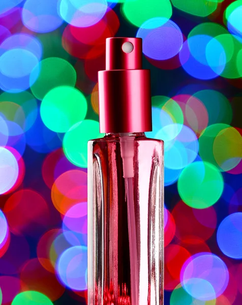 Perfumy dla kobiet w butelkę na uroczysty błyszczącym tle — Zdjęcie stockowe
