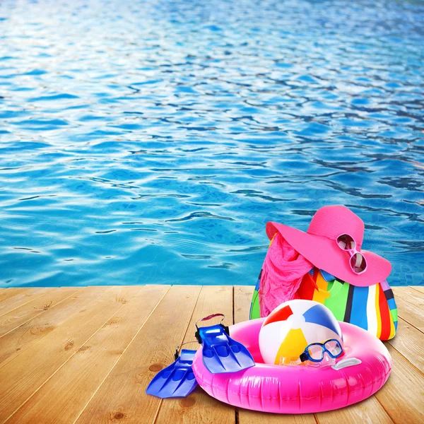 Bright beach accessories on sea background — Stock Photo, Image