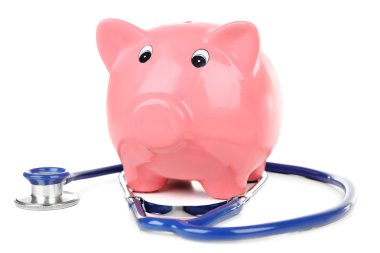 Beyaz izole stetoskop ile Piggy banka