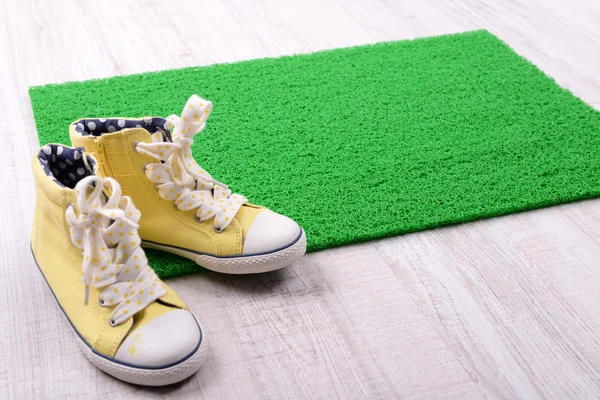 Green carpet and converse — Stock Photo, Image