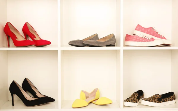 Collection of shoes on shelves — Stock Photo, Image