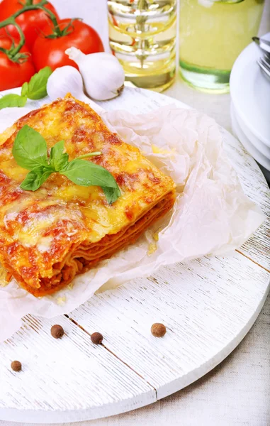 Portion of tasty lasagna on table — Stock Photo, Image