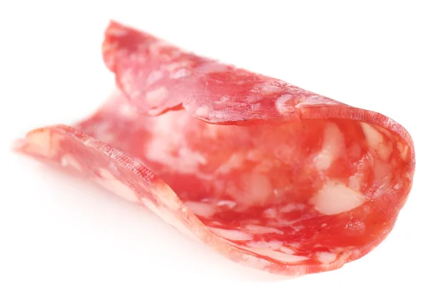 Fatia de salame isolado no fundo branco — Fotografia de Stock
