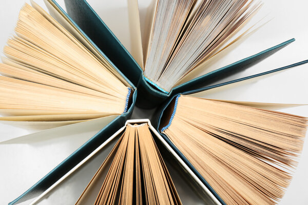 Group of books on white background, top view