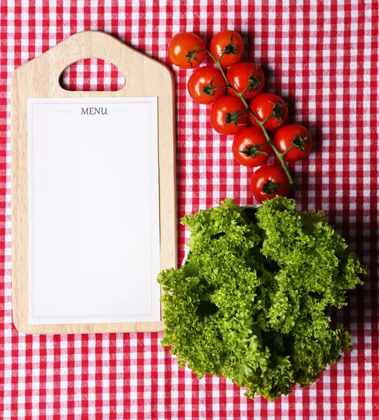 Cutting board with menu paper — Stock Photo, Image