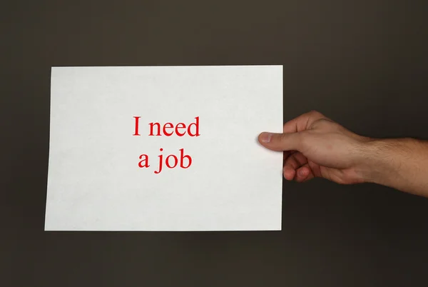 Inskriften som jag behöver ett jobb — Stockfoto