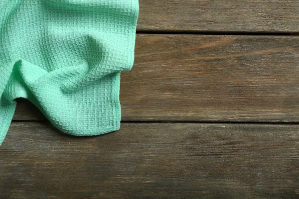 Napkin on wooden table — Stock Photo, Image