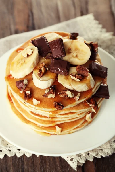 Pancakes with chocolate, honey, nuts — Stock Photo, Image