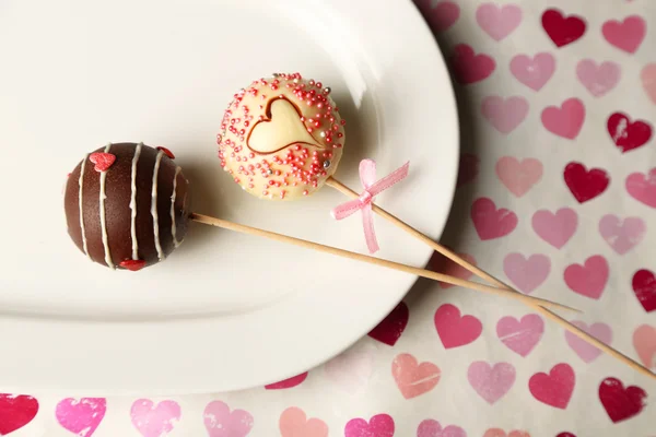 Tasty cake pops on plate — Stock Photo, Image