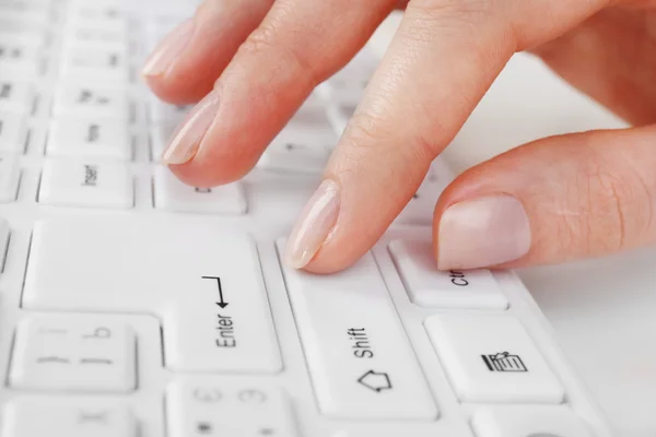 Female hand typing on keyboard — Stock Photo, Image