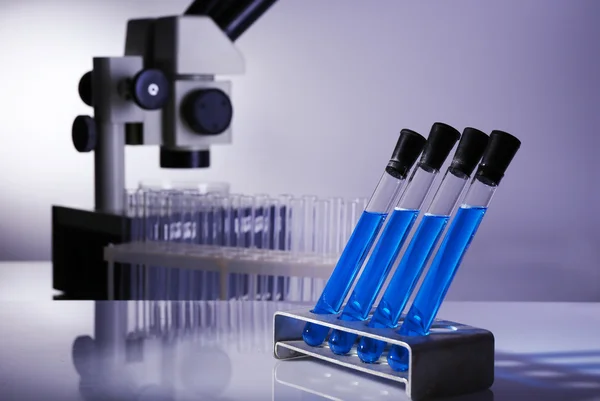 Laboratory glassware with blue liquid — Stock Photo, Image