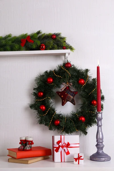 Christmas wreath on shelf — Stock Photo, Image