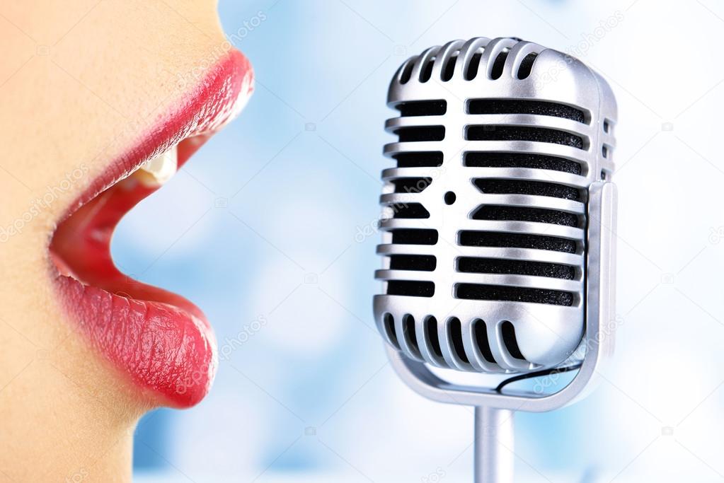 Singing woman and retro microphone, karaoke concept