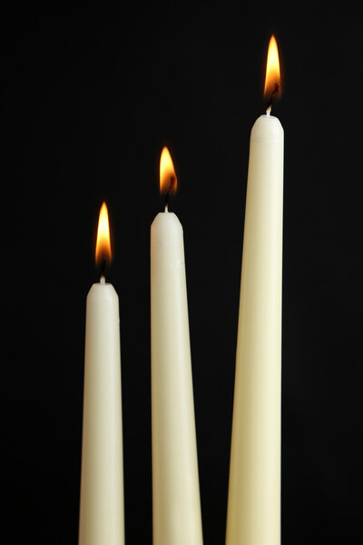 Three burning candles