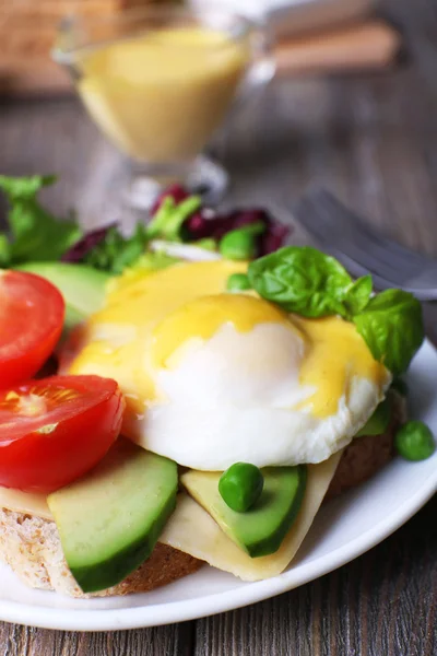 Toast, egg Benedict and avocado — Stock Photo, Image