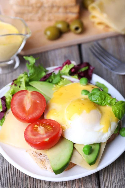 Toast, egg Benedict and avocado — Stock Photo, Image