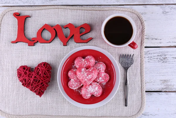 Romantic still life with cookies in form of heart on color wooden planks background — Stock Photo, Image