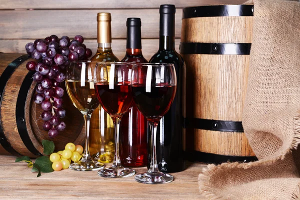 Different wine on table on wooden background — Stock Photo, Image