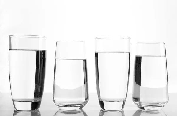 Glasses of water on light background — Stock Photo, Image