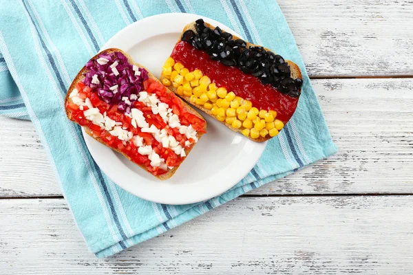 Sandwiches with  different flags on table close-up — Stock Photo, Image