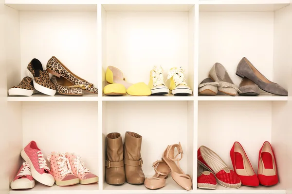 Collection of shoes on shelves — Stock Photo, Image