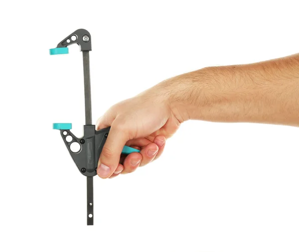 Σφιγκτήρας εργαλείο στο αρσενικό χέρι που απομονώνονται σε λευκό — Φωτογραφία Αρχείου