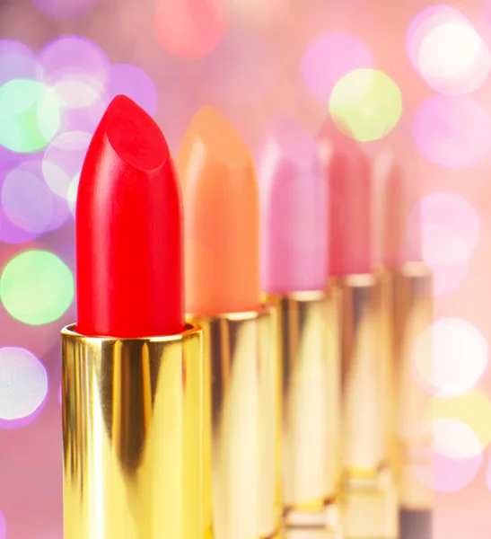 Set of lipsticks on colorful background — Stock Photo, Image