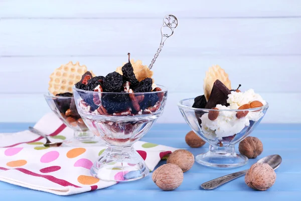 Dessert with prunes in glass bowls — Stock Photo, Image