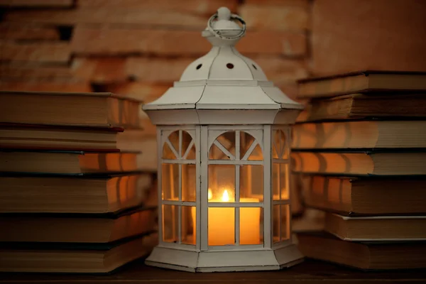 Books and decorative lantern — Stock Photo, Image