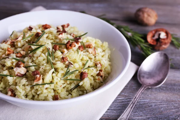 Rice with walnuts  in plate — Stock Photo, Image