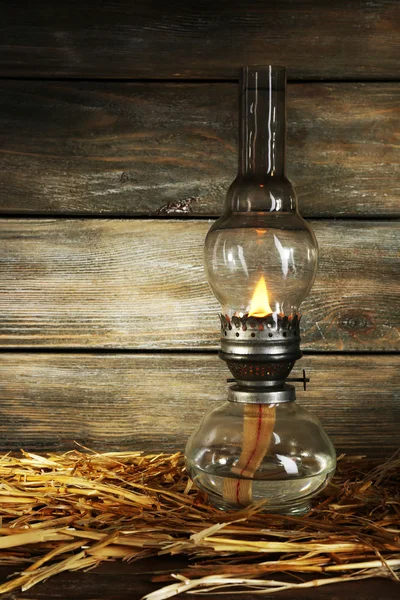 Kerosene lamp with hay — Stock Photo, Image