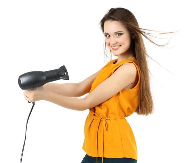 Hermosa mujer joven con pelo largo sosteniendo secador de pelo aislado en blanco — Foto de Stock