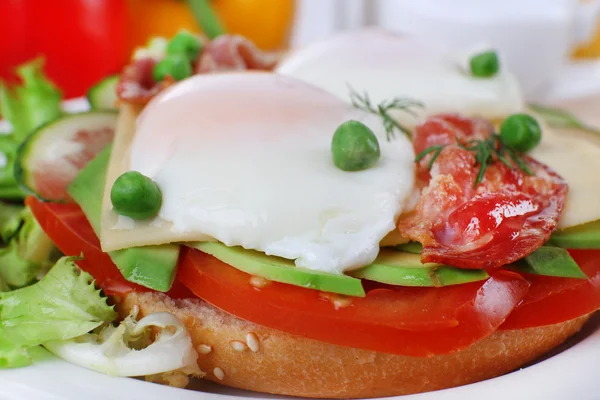 Sandwich with poached eggs — Stock Photo, Image