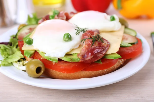 Sandwich with poached eggs — Stock Photo, Image