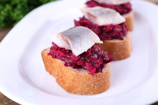 Rye toasts with herring — Stock Photo, Image