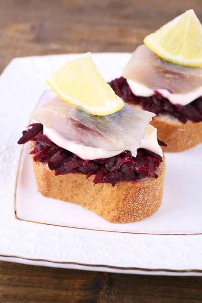 Rye toasts with herring — Stock Photo, Image