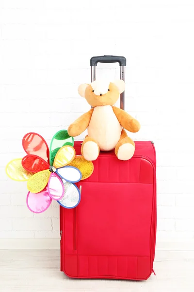 Suitcase with toy flower — Stock Photo, Image