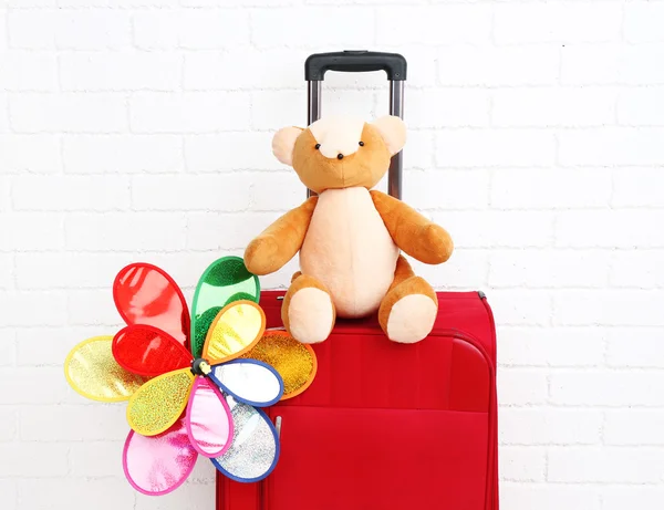 Suitcase with toy flower — Stock Photo, Image