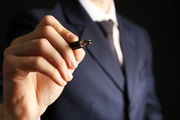 Businessman writing on screen