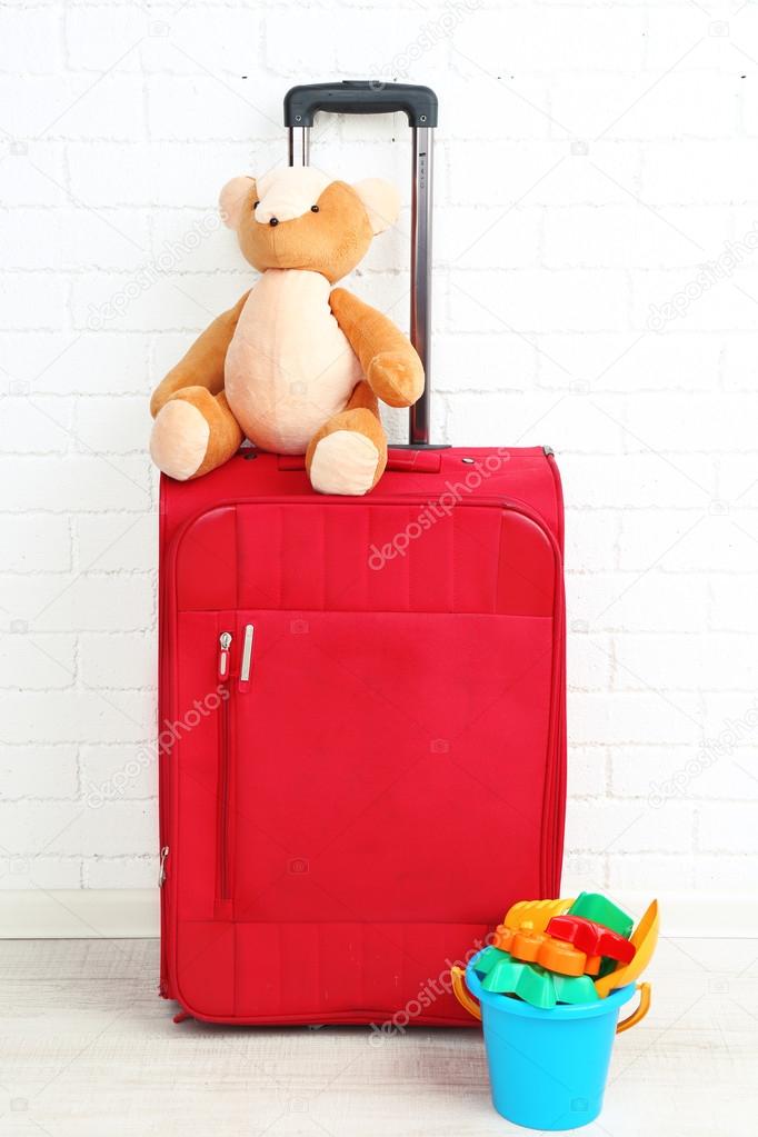 Suitcase with teddy bear