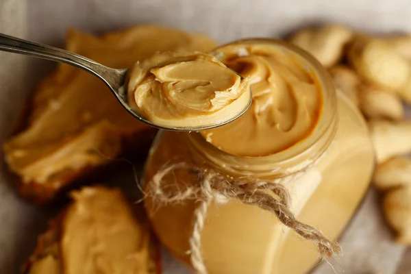 Fresh peanut butter in jar, close up — Stock Photo, Image